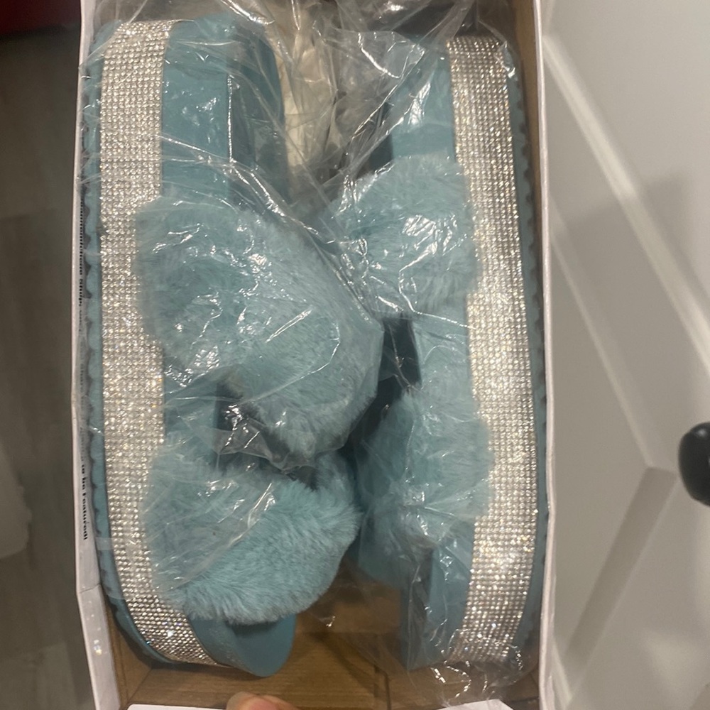 Light blue slippers with silver trim